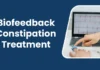 Biofeedback therapy for constipation treatment shown on a computer screen with a pulse sensor.
